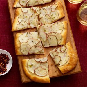 Close up of Potato Herb Flatbread on wood surface