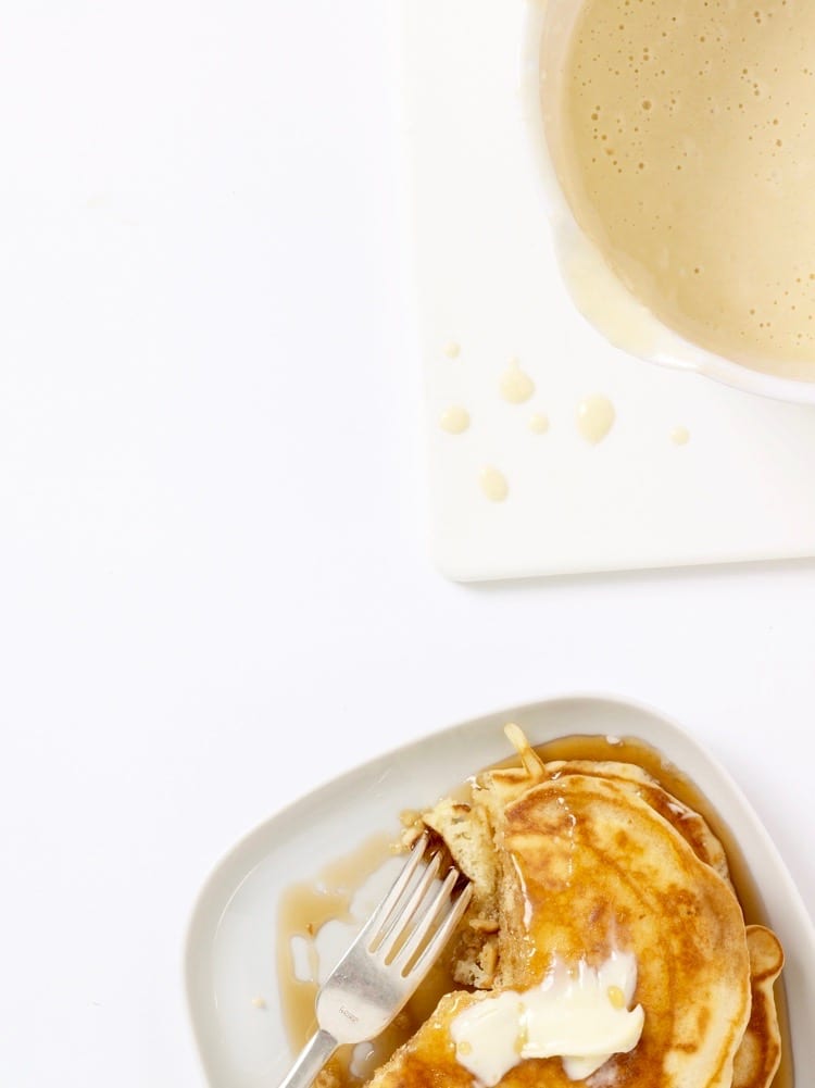 pancakes from pantry ingredients on white plate with fork and batter in corner