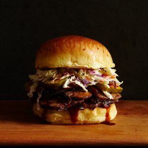 close up of Slow Cooker Brisket Sandwich on black background