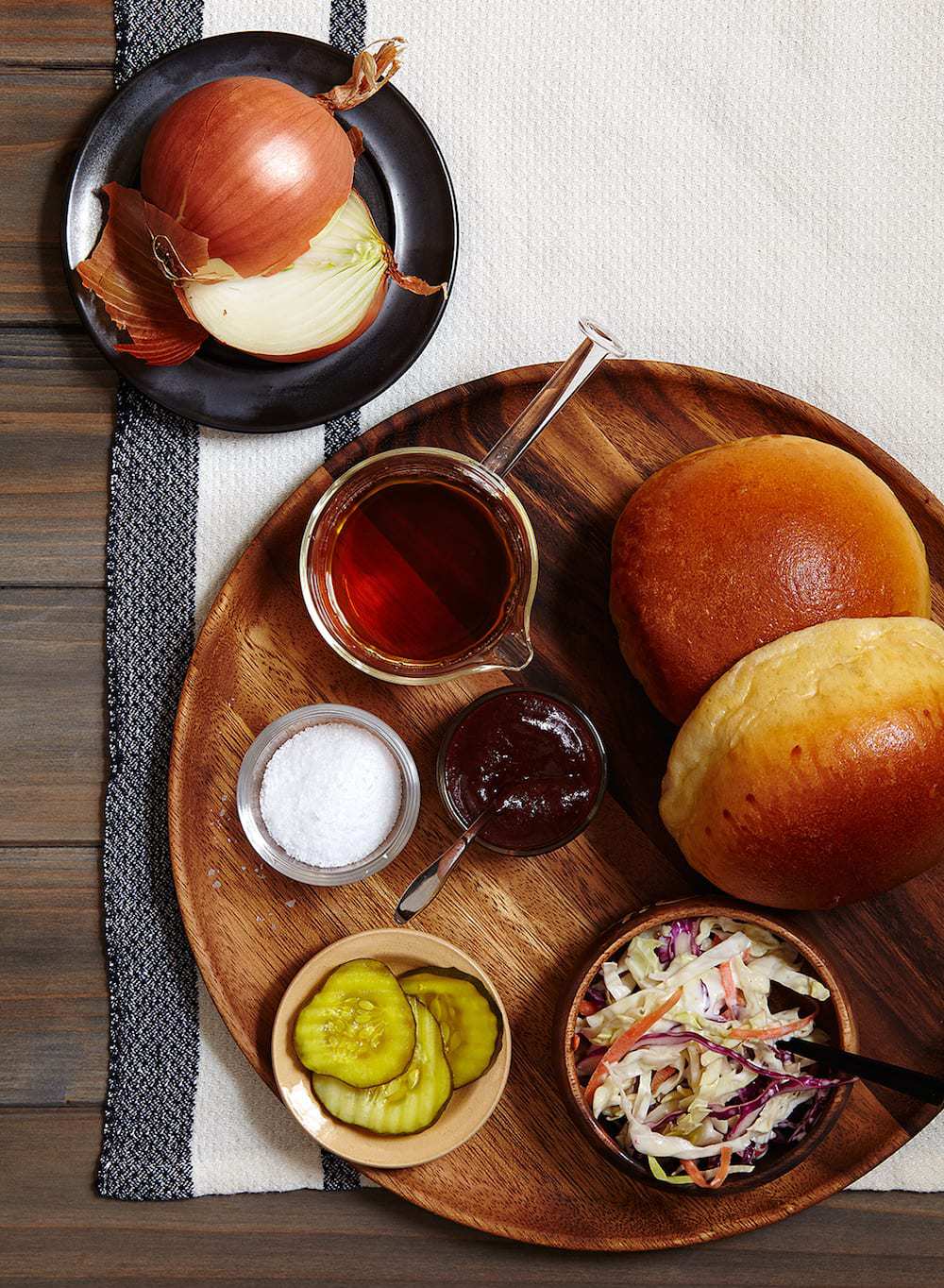 Overhead view of brisket sandwich toppings and ingredients. 