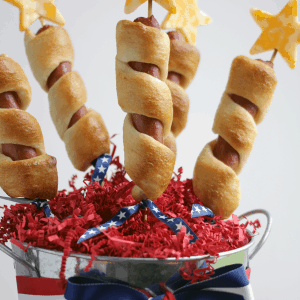 Hot dogs on a stick wrapped in delicious pastry with stars of cheese