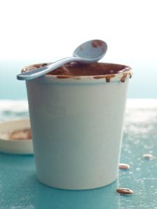 Tara Teaspoon's recipe for homemade ice cream in a white tub is rich and creamy with loads of chocolate ice cream flavor.