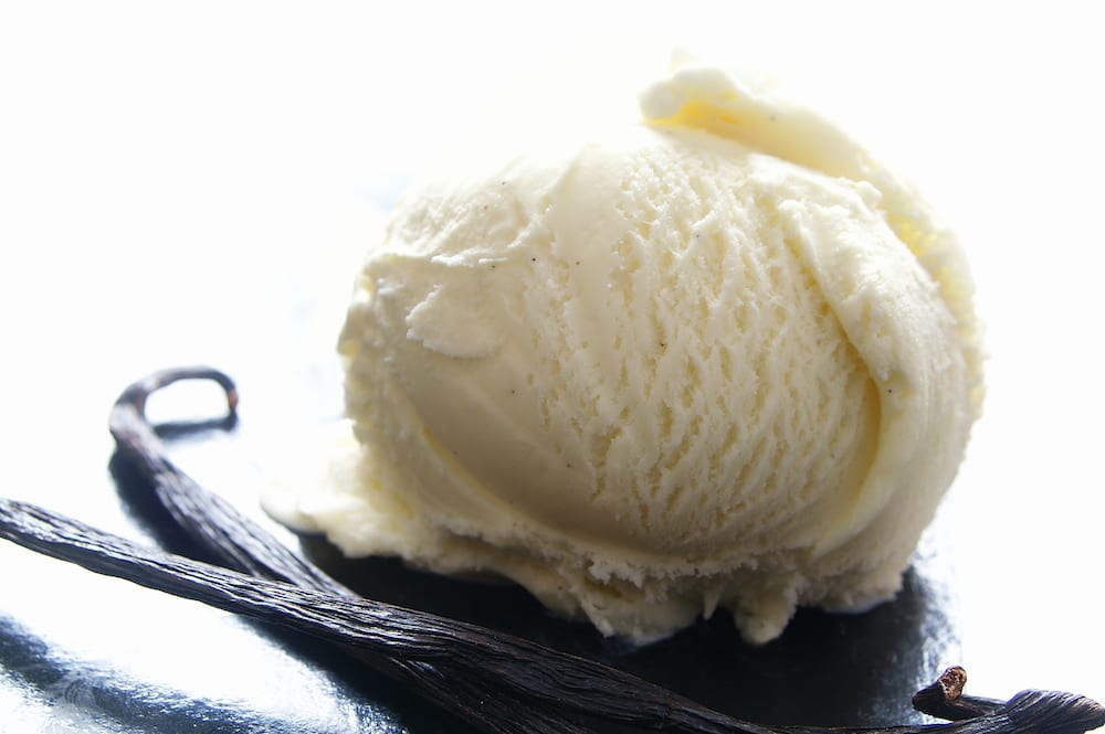 Scoop of vanilla ice cream with vanilla beans