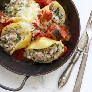 Easy Sausage Stuffed Shells in small metal wok pan with handles