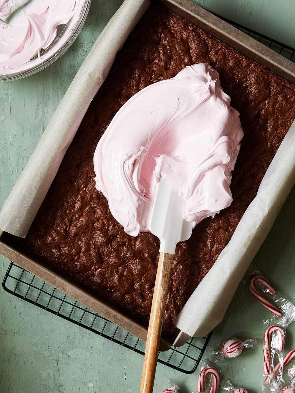 holiday peppermint brownies with pink frosting smear