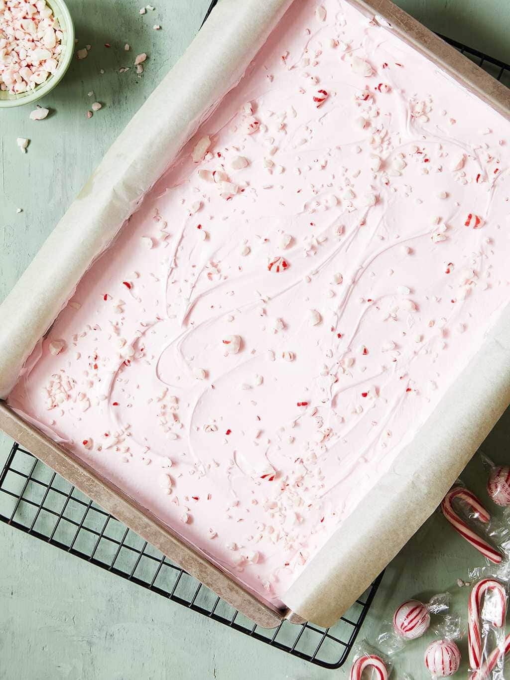 holiday peppermint brownies with pink frosting and candy