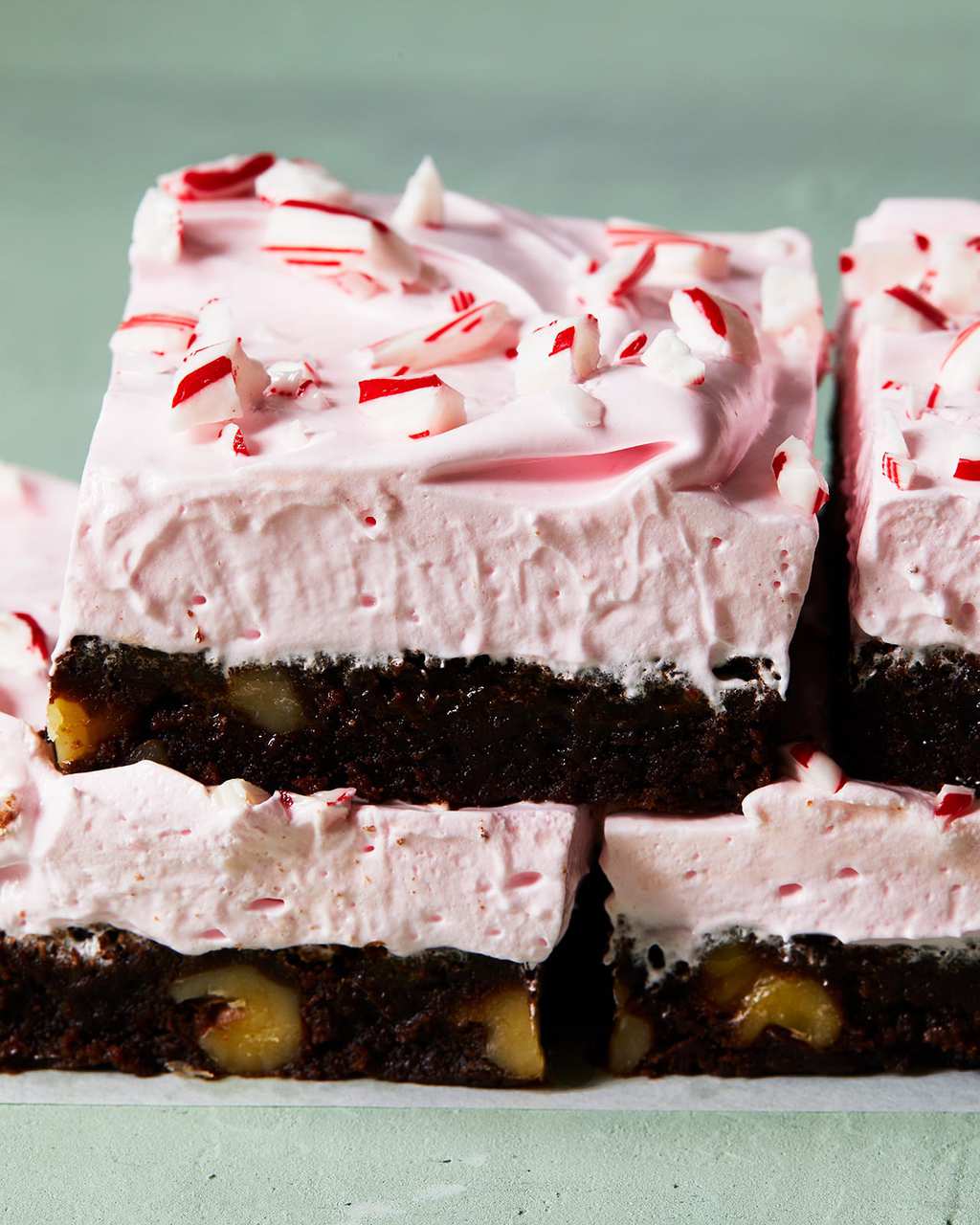 holiday peppermint brownies with pink frosting close up
