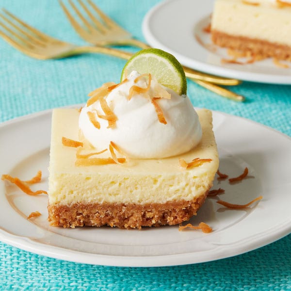 Key Lime Bars on white plate and turquoise linen