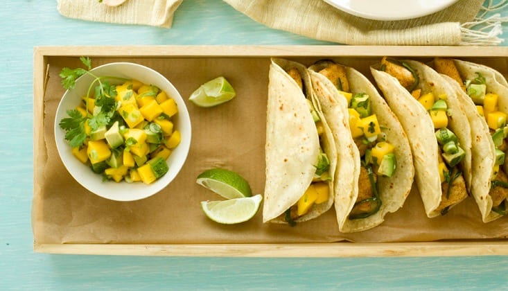 fish tacos with mango and avocado salsa close up