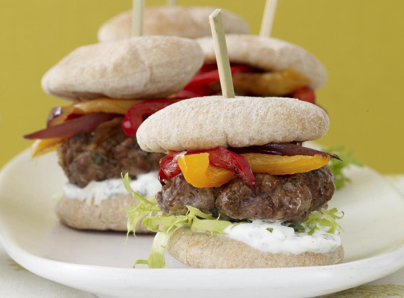 Looking into the mini Greek lamb burgers with roasted peppers close crop