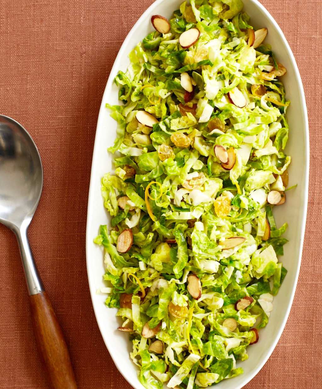 Shredded Brussels Sprouts with Orange and Almond in an oval dish