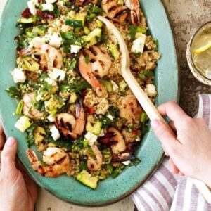 Grilled Shrimp with zucchini and couscous stirring