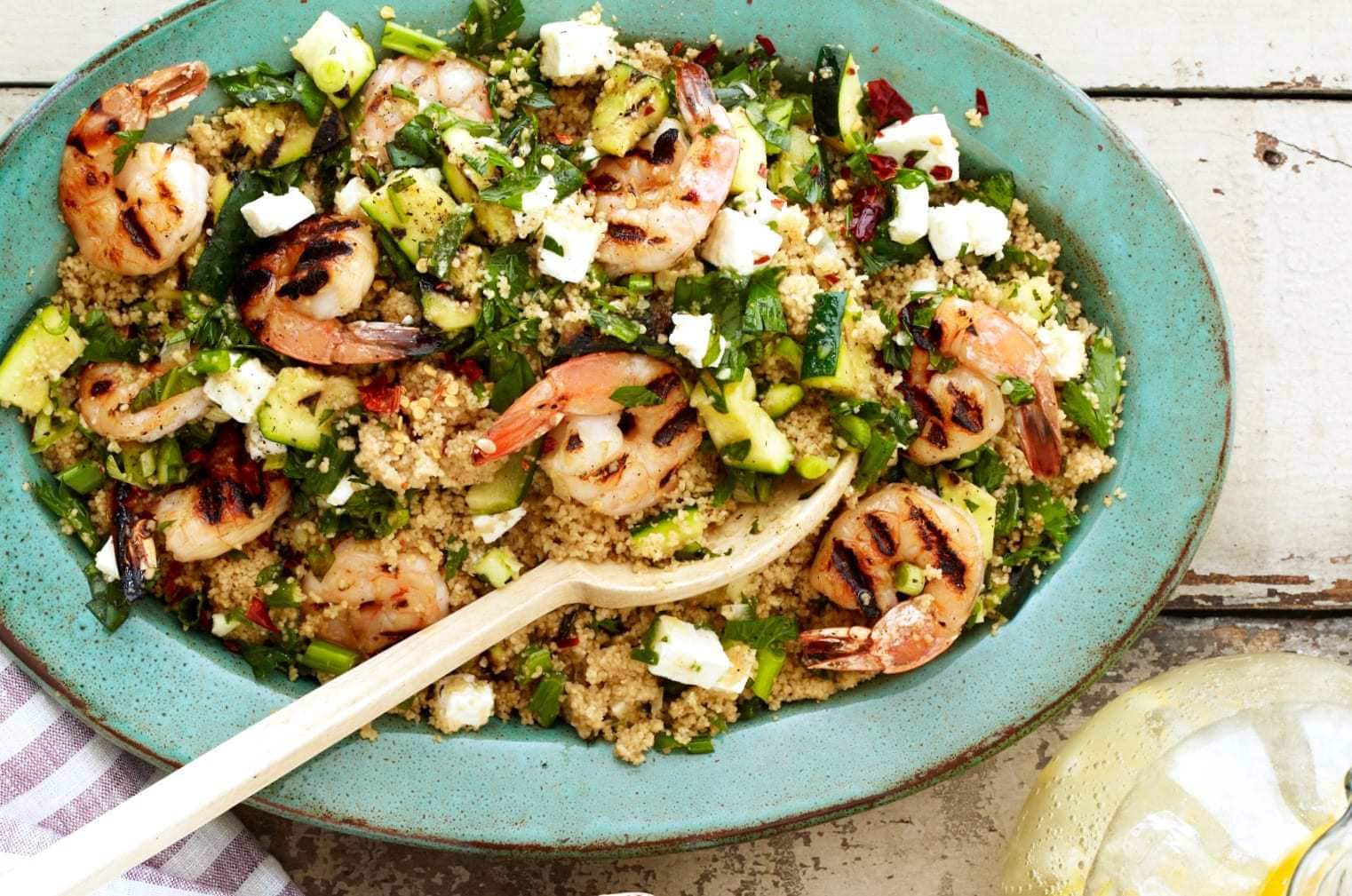 Grilled Shrimp and Zucchini Couscouse with Feta in green bowl with spoon