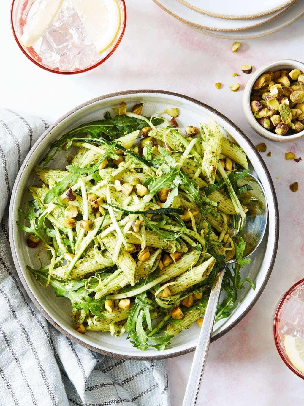 Close up of pistachio pesto pasta with green pistachios