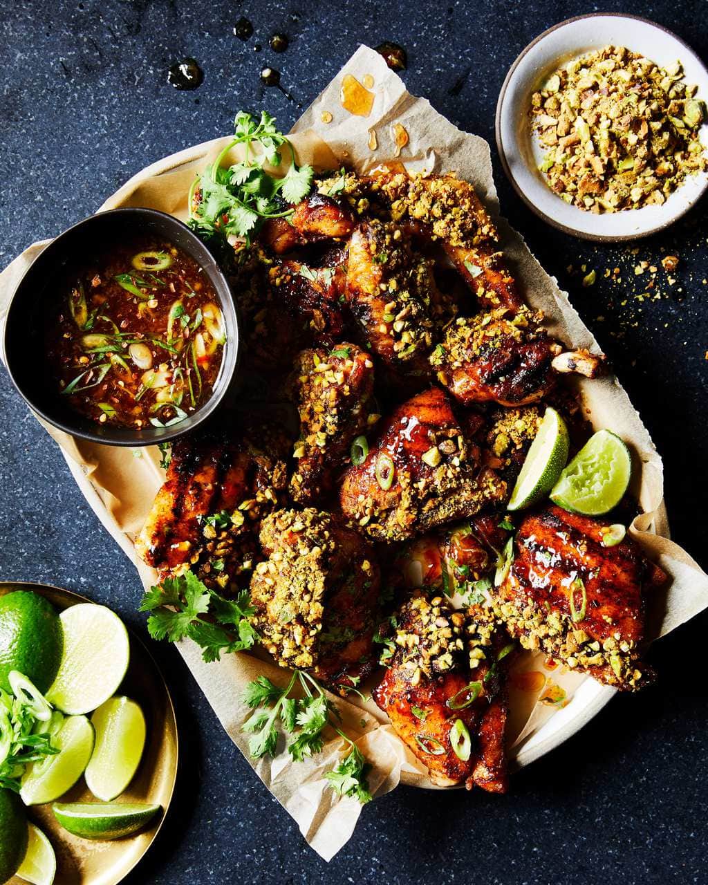 sticky sweet chili chicken with pistachios on platter