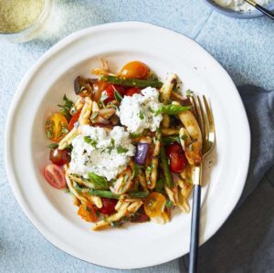 Italian Tomato and Eggplant Skillet Pasta in white bowl