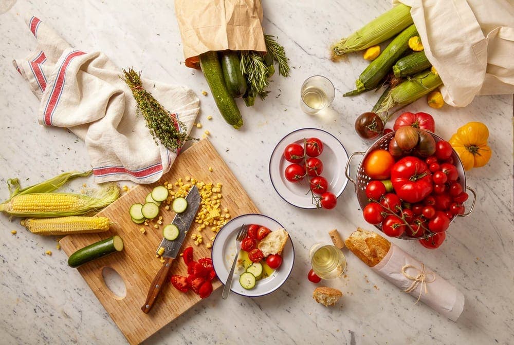 Summer vegetables from the garden on a marble surface