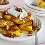 Close up of grilled pineapple on a small plate.