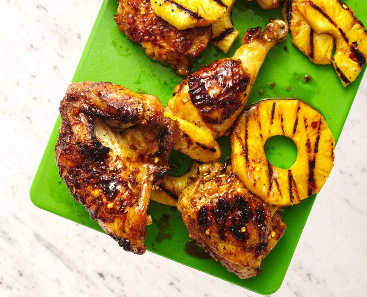 Soy and ginger marinated grilled pineapple chicken on cutting board