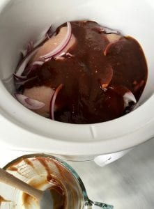 sauce covered chicken breast in slow cooker
