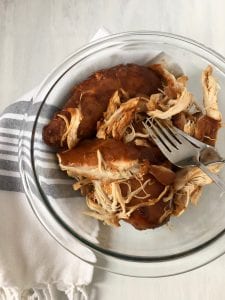 shredded chicken in clear glass bowl