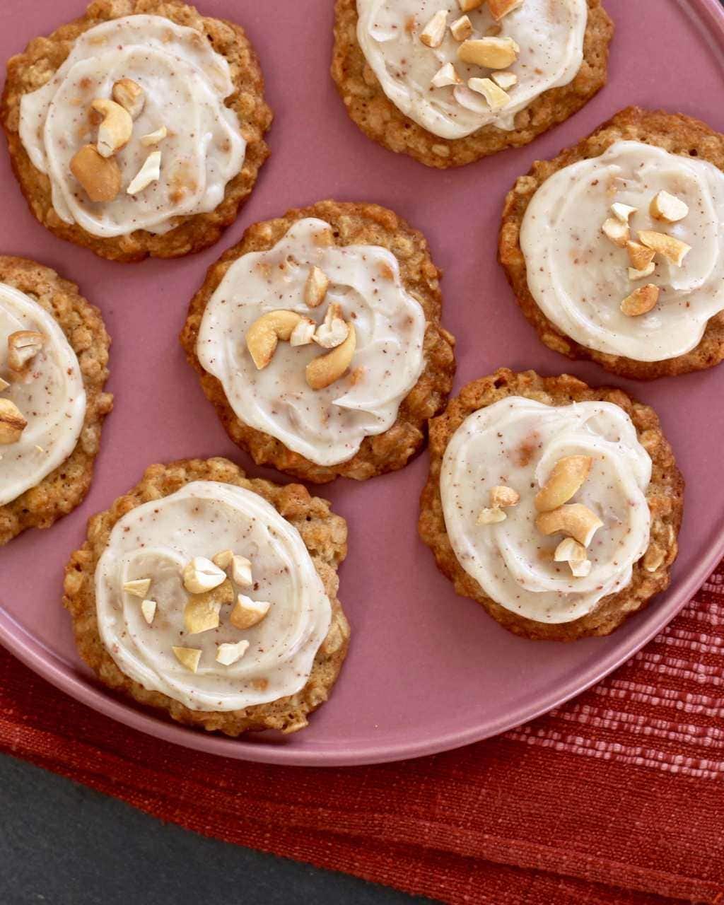 Cashew Cookies with Brown Butter Frosting overhead on a pink plate