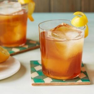 An Earl Grey Cocktail is a sophisticated tea cocktail with a lemon curl