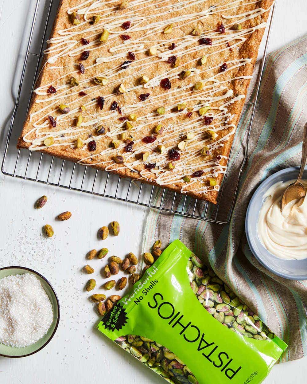 Wonderful Pistachios and Cherry Cookie Bars with bag of pistachios