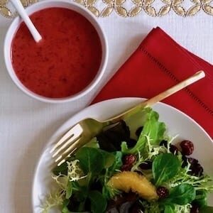 Winter Salad with oranges and bowl of cranberry vinaigrette