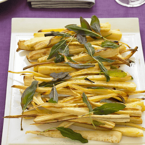 Roast Parsnips on a platter with fried sage