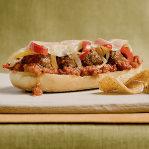 A delicious open face meatball sub on a cutting board