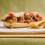 A delicious open face meatball sub on a cutting board