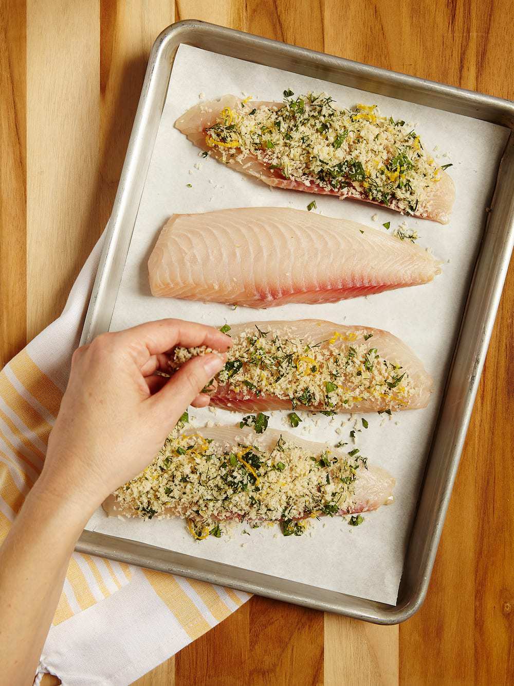 lemon fish fillets on a baking sheet