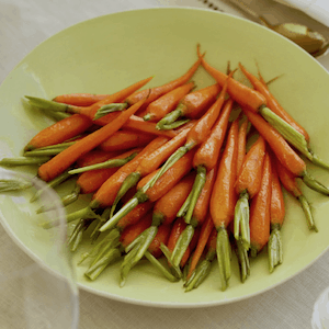 Brown Sugar and White Wine glazed carrots in green bowl