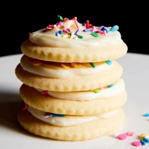 rainbow sprinkles on stack of soft sugar cookies