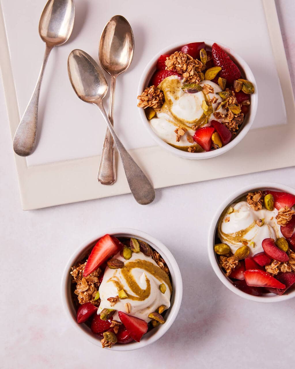 yogurt bowls with pistachio butter and strawberries