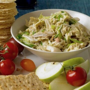 Curry Crab dip spread with apples, tomatoes, and crackers.