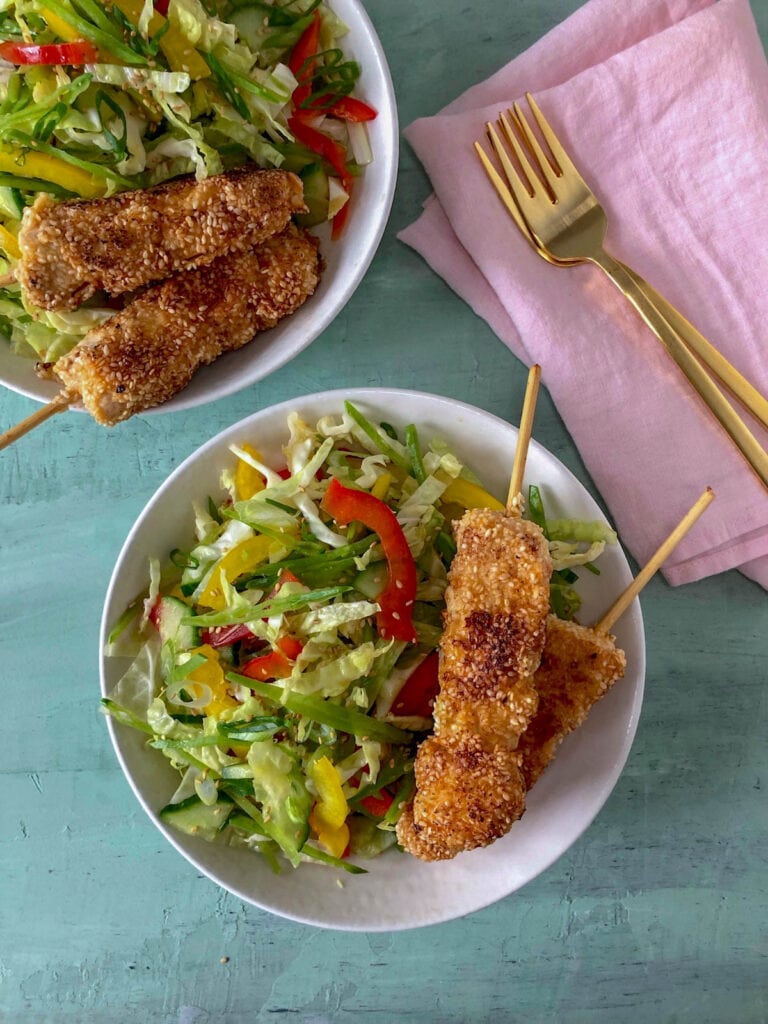 Sesame Chicken and Ginger Cole Slaw on blue surface