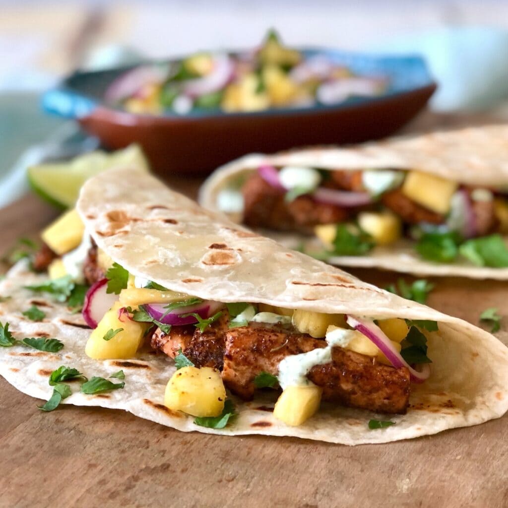 tacos featuring crema and pineapple salsa
