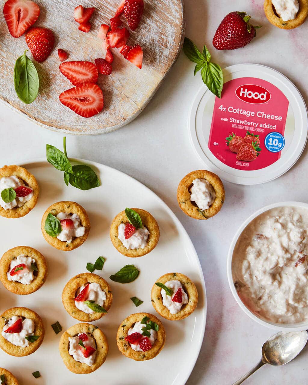 Sugar Cookie cups with strawberries and basil on a white platter