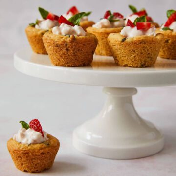 Strawberry basil sugar cookie cups on a cake pedistal