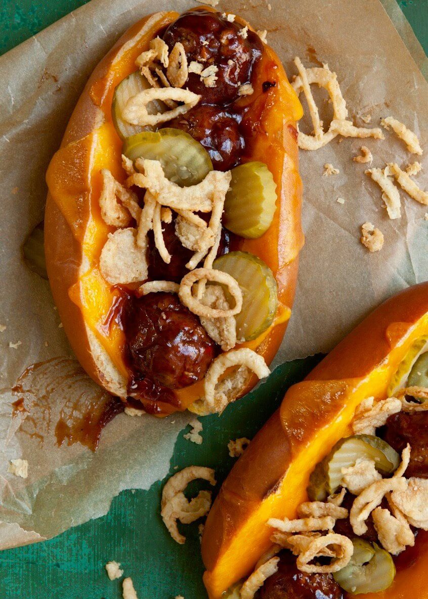 Barbecue Meatball sandwich with cheddar, pickles and onions