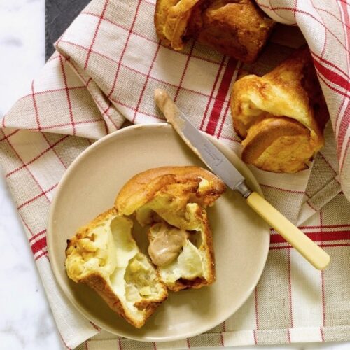 apple popover open on plate with maple butter