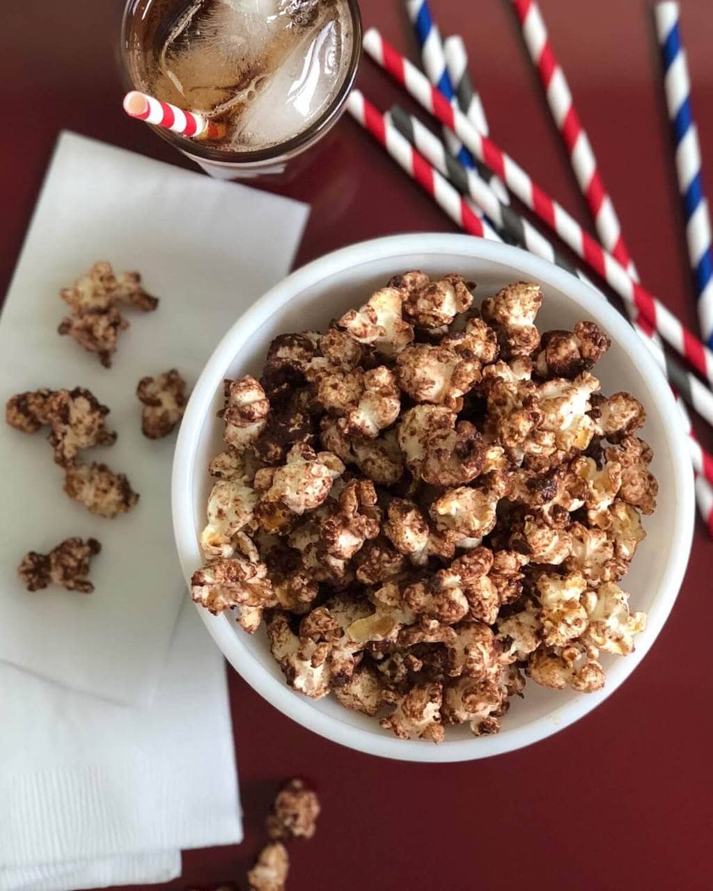 chocolate malt flavored popcorn on a soda shop red table
