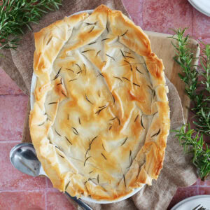 Overhead view of a chicken spinach casserole topped with phyllo dough.