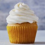 Vanilla cupcake with fluffy white frosting