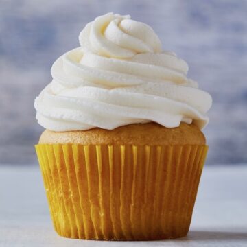 Vanilla cupcake with fluffy white frosting