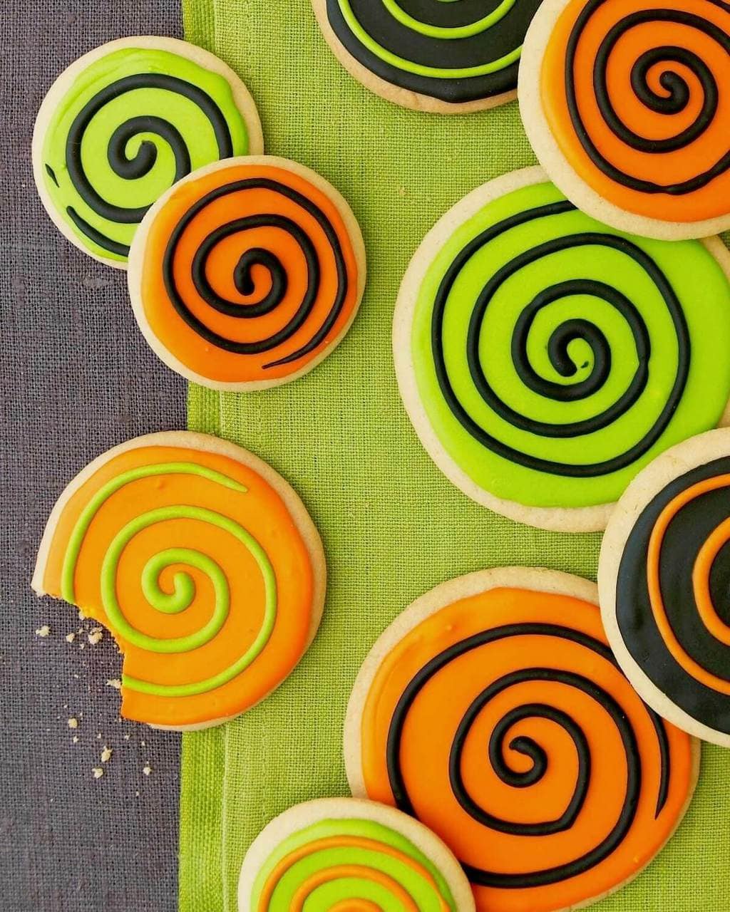 Spooky spiral halloween cookies with orange green and black frosting