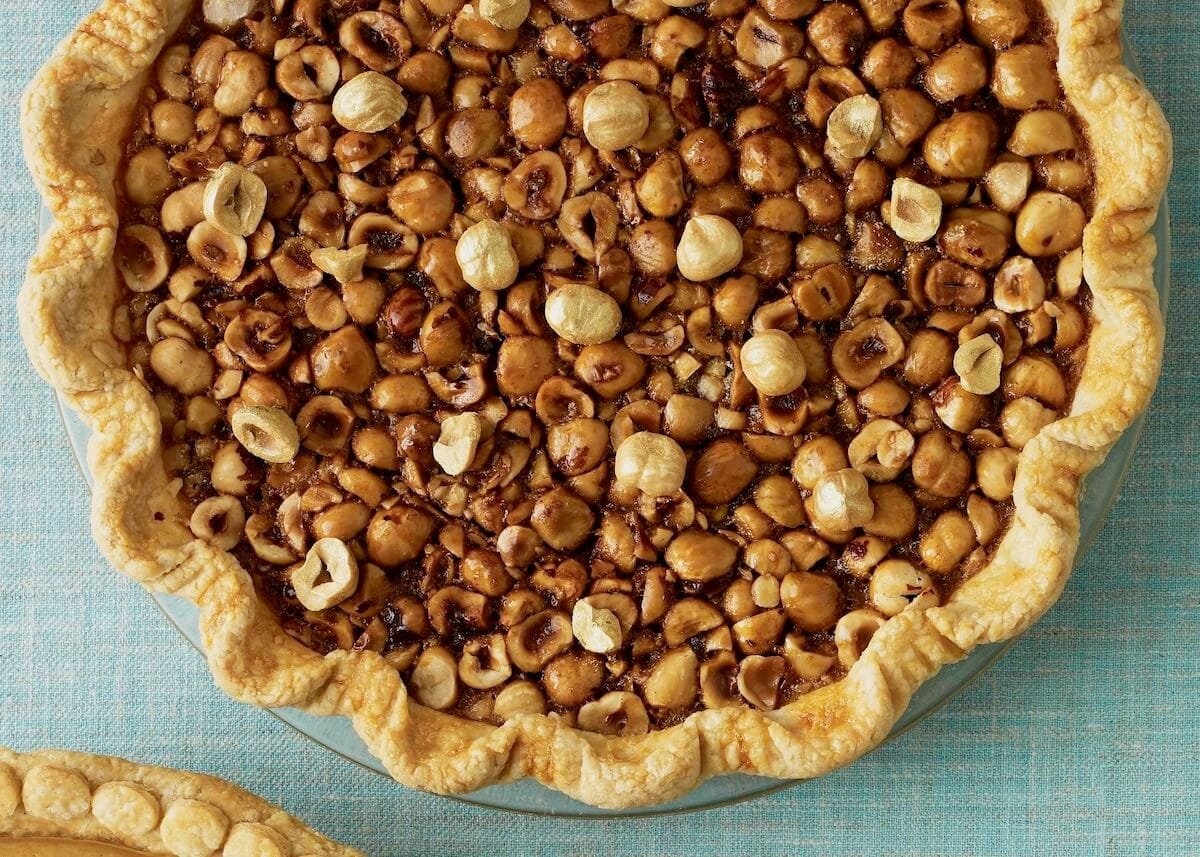 Maple Caramel Pie with Hazelnuts on turquoise linen