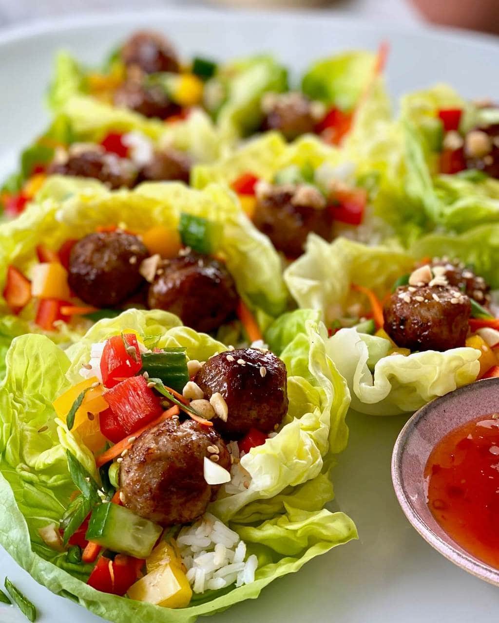 vertical image of meatball lettuce wraps with rice